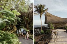 people walking and riding bikes on a path next to the ocean in front of a thatched hut