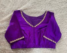 Hand embroidered ready made saree blouse / crop top/stitched saree blouse usa / purple v neck  saree blouse/ hand embroidered blouse/zardosi blouse/v neck  saree blouse/ purple pure silk blouse/ maggam work blouse        It is very true that a perfect blouse is the one which makes your saree look stand out !! If you find one of such a style that you have been wanting to have then dont let it go !! we carry such unique trending blouses that instantly add a stylish look to any saree !!     Well..!! we understand that you may not get in your desired size/pattern, here you go with customization according to your size/pattern which we can deliver in 1-2 weeks of time period !!      Here is a beautiful Hand embroidered saree blouse in pirple color that has simple yet unique embroidery on necks a Affordable V-neck Blouse With Zari Work, Fitted Blouse With Multicolor Embroidery At Cheap Price, Luxury Purple Blouse With Resham Embroidery, Luxury Purple Blouse Piece With Embroidered Border, Luxury Purple Blouse Piece With Zari Weaving, Luxury Purple Handloom Blouse Piece, Luxury Purple Chanderi Blouse, Luxury Purple Blouse Piece With Dori Work, Luxury Purple Blouse With Intricate Embroidery