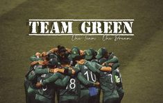 a group of baseball players huddle together on the field with their arms around each other