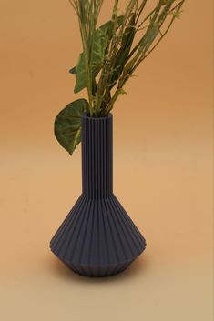 there is a vase with some plants in it