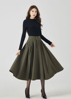 "Elevate your winter fashion with our military green wool pleated midi skirt. The deep military green color adds a touch of classic charm, and the high-quality wool fabric provides both style and warmth. The meticulously designed pleats create an elegant and dynamic look. Whether you're dressing up for work or a special occasion, this pleated midi skirt is a versatile and fashionable choice to keep you both chic and snug. DETAIL * 30% wool, 30% fiber, 40% polyester * polyester lining * Two pockets * Front zipper and buttons closure * Below knee length effect * Perfect for autumn winter * Dry cleaning * Lean More about the items From the FAQs on the page bottom MODEL SIZE Bust 85 cm(33.4\") Waist 67 cm(26.7\") Height 168cm (5' 6\") She wears size XS CUSTOM MADE SERVICE If you * Change other Autumn Outfits Skirt Midi, Cloak Dress, Summer Coats, Academia Style, Skirt Outfits Fall, Wool Clothing, Stylish Dresses For Girls, Wool Skirts, Pleated Midi Skirt