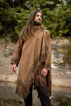 Our JUBBA cloak is a hybridised combination of a jacket, poncho, cloak and robe . . . it has a large hood, long sleeve and a pocket . . . can be worn open or closed with a coconut button on the shoulder . . . JUBBA is made of 100% naturally dyed and block printed cotton . . . Inspired by the post-apocalyptic dune-like dystopian clothing styles, JUBBA is designed for festivals and walkabouts . . . Measurements: Length: 91 cm / 35.8 inches Shoulder sleeve length: 64 cm / 25.1 inches Underarm sleev Poncho Cloak, Mens Kimono Jacket, Ritual Clothing, Mens Poncho, Yellow Evening Dresses, Poncho Jacket, Hemp Clothing, Viking Clothing, Festival Pants