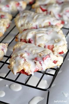 strawberry scones cooling on a rack with icing