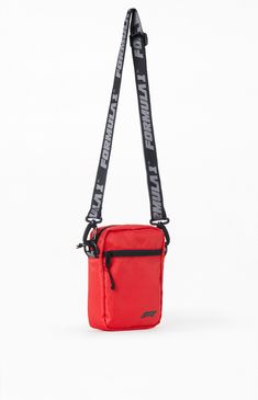 PacSun exclusive! Race through your day in style with the Formula 1 x PacSun Crossbody Bag. This collaboration presents a trendy crossbody bag that effortlessly combines functionality with racing-inspired flair, making it the perfect accessory for the fast-paced fashion enthusiast on the move.


	Adjustable crossbody strap
	Zipper front pocket
	Formula 1 branding
	Zipper closures
	6" W x 9" L x 2" D
	100% polyester Red Functional Mobile Phone Bag, Red Rectangular Bag For Streetwear, Red Rectangular Shoulder Bag For Outdoor Use, Red Rectangular Shoulder Bag For Outdoor, Functional Red Bag With Cell Phone Pocket, Sporty Red Bag For Streetwear, Red Crossbody Bag For Outdoor, Casual Red Shoulder Bag For Outdoor, Red Sporty Outdoor Bag