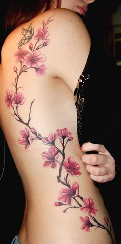 a woman's stomach with flowers on it