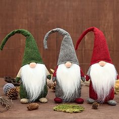 three gnomes are standing next to each other