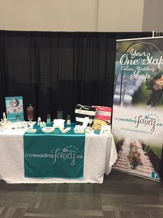 a table that has some items on it and is set up in front of a black curtain