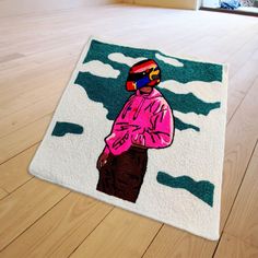 a rug on the floor with a painting of a person wearing a helmet and goggles