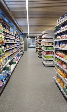 an aisle in a grocery store filled with lots of food