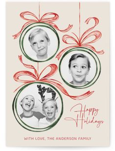 a holiday card with three children's faces