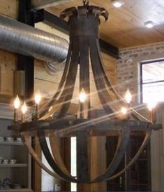 a chandelier made from an old wine barrel