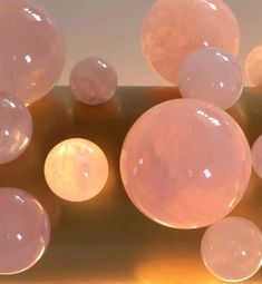 several large pink bubbles floating on top of each other