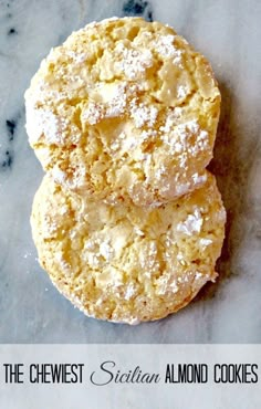 two cookies with powdered sugar on top and the words, the cheesy sicilian almond cookies