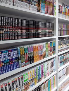 a store filled with lots of different types of sodas and cans on the shelves