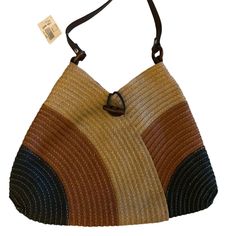 Elevate Your Everyday Style With This Chic Shoulder Bag, A Perfect Blend Of Functionality And Fashion. The Multicolor Striped Exterior, Woven From Durable Paper Yarn, Offers A Unique Texture That's Sure To Turn Heads. A Magnetic Snap Closure Secures Your Belongings, While The Neutral Fabric Lining Provides A Soft Touch Inside. Organize Your Essentials With Ease Thanks To The Zippered Interior Pocket. Leather Straps Ensure Comfortable Carrying, And The Wooden Ring Attachments Add A Touch Of Earth Modern Brown Beach Bag, Casual Multicolor Hobo Bag With Leather Handles, Modern Brown Shoulder Bag For The Beach, Modern Brown Shoulder Bag For Beach, Trendy Multicolor Hobo Bag For Vacation, Casual Multicolor Hobo Bag With Braided Handles, Brown Tapestry Shoulder Bag With Leather Handles, Eco-friendly Brown Woven Leather Shoulder Bag, Eco-friendly Multicolor Jute Shoulder Bag