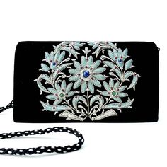 "Stunning black velvet evening bag, hand embroidered with shimmery silver and pale blue metallic flowers and embellished with genuine lapis lazuli and green onyx, to create a shimmery, dazzling 3D effect. Add an eye-catching pop of color, texture and sparkly bling to your overall party look. It is just the right size to hold your essentials for the night - phone, credit cards, money, keys and lipstick. The shoulder strap keeps your hands free for carrying a drink or holding a plate of food. Or t Holding A Plate, Plate Of Food, Silver Clutch Bag, Purse Luxury, Velvet Clutch, Floral Clutches, Silver Clutch, Party Purse, Embroidered Bag