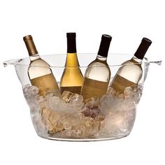 three bottles of wine sitting in an ice bucket