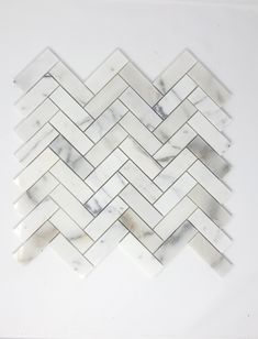 a white marble herringle tile pattern