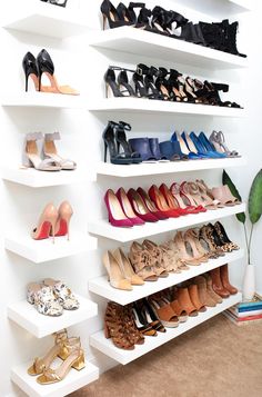 there are many pairs of shoes on the shelves