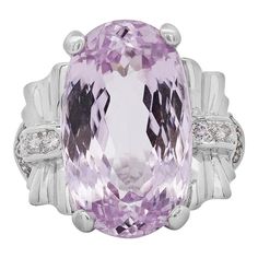 20.96-carat oval-cut light pink kunzite, surrounded by 0.28 carats total weight of round-cut halo diamonds, set in a delicate platinum filigree design for a refined and timeless look.  Details:  Item Type: Statement Ring Metal: Platinum 900 Size: 7 Weight: 13.15 Grams   Center Gemstone Details: Type: Kunzite Carat: 20.96 Carat Color: Light Pink Cut: Oval Cut   Side Stones Details:  Type: Diamonds Cut: Round Carat: 0.28 CTTW  A stunning 20.96-carat oval Kunzite gemstone as its centerpiece, with a light pink hue that radiates femininity and sophistication. The gem is beautifully complemented by a halo of sparkling diamonds, totaling 0.28 carats, which are set in a detailed platinum filigree setting. Perfect for special occasions or as a statement piece, this ring offers a timeless and luxuri Boho Chic Engagement Ring, Purple Engagement Rings, Red Engagement Ring, Art Nouveau Engagement Ring, Kunzite Ring, Citrine Ring Engagement, Tanzanite Engagement Ring, Garnet Engagement Ring, Pink Kunzite