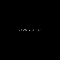 a black background with the words grow silently