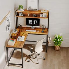 a desk with a computer on it and a potted plant next to the desk