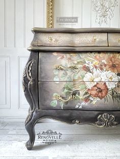 an ornate painted dresser with flowers on it