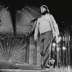 a man standing on top of a stage