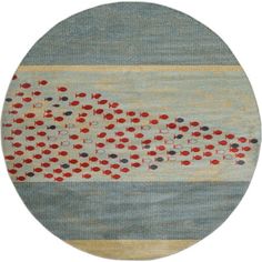 a round rug with red and blue dots on it