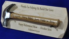 a hammer is on display in front of a plaque that reads, thanks for helping us build our lives