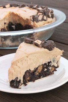 a piece of cake sitting on top of a white plate next to a pie pan