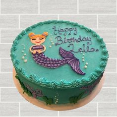 a birthday cake with a mermaid theme on it