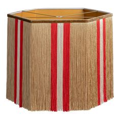 a lamp shade with red and white stripes