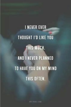 a person holding their hand up in the air with text that reads, i never thought i'd like you this much and i never planned to have on my mind