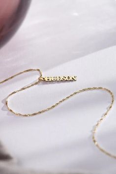 Make a statement with our Vertical Name Necklace, tailored to showcase your unique identity. Perfect for adding a touch of personal charm to any look. #NameNecklace #PersonalizedJewelry #SignatureStyle #thecustomgoodsco #customjewelry #jewelry #handmadejewelry #finejewelry Personalized Yellow Gold Name Necklace For Anniversary, Customized Nameplate Jewelry For Anniversary Gift, Custom Name Yellow Gold Jewelry For Anniversary, Custom Name Nameplate Jewelry For Anniversary Gift, Custom Name Jewelry For Valentine's Day, Valentine's Day Jewelry With Adjustable Chain For Anniversary, Custom Name Jewelry For Valentine's Day Personalized Gift, Adjustable Chain Jewelry For Anniversary And Valentine's Day, Personalized Adjustable Fine Jewelry