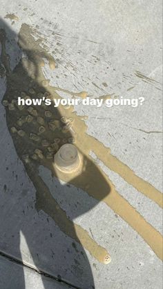 the shadow of a person standing on top of a sidewalk next to a fire hydrant that says how's your day going?