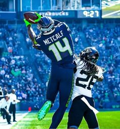 a football player jumping in the air to catch a ball