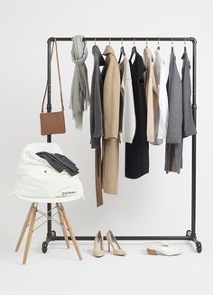 an ironing board with clothes hanging on it