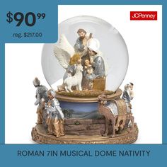 a snow globe with figurines in it and the words roman musical dome nativity