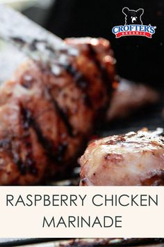 a close up of meat on a grill with the words raspberry chicken marinade