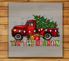 an old red truck with a christmas tree on the back and it's the season