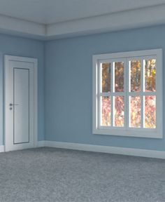 an empty room with blue walls and white trim on the windows, carpeted floor