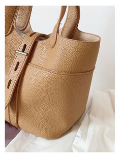 Soft leather bucket bag with matching inner pouch. Material: High Quality PU Leather Crossbody strap included Size approximately 6.9"H x 9.4"W x 5.1"D Designer Style ID: 8734 Bucket Leather Bag with Shoulder Strap and Inner Pouch, Women's Everyday Handbag Shopping Satchel With Detachable Strap In Bucket Shape, Shopping Bucket Shaped Satchel With Detachable Strap, Solid Bucket Bag With Detachable Strap For Daily Use, Bucket Satchel With Detachable Strap, Daily Use Bucket Satchel With Gold-tone Hardware, Daily Use Bucket Shoulder Bag With Gold-tone Hardware, Beige Faux Leather Bucket Bag With Removable Pouch, Beige Faux Leather Bucket Bag For Shopping, Gold-tone Hardware Bucket Shoulder Bag For Daily Use