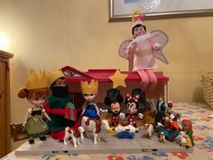 a group of toy figurines sitting on top of a table