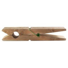 a pair of wooden scissors with green handles