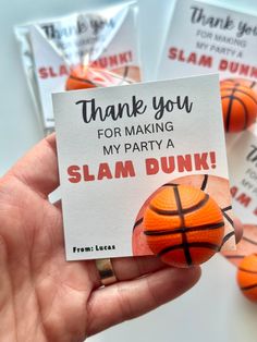 a hand holding up a card that says thank you for making my party a slam dunk