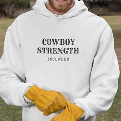 Cowboy Strength Hoodie 80% Cotton, 20% Polyester Mid Weight Fleece Superior Combed and Ring Spun Cotton Unisex Fit. (Men or Women) Water Based Ink (Eco-Friendly) High-Quality Print Wash Instruction: Machine Wash Warm, with Like Colors. Tumble Dry Low, Do not Dry Clean. Cowboy Hoodie, Fit Men, New T, Gifts For Men, Unisex Hoodies, Cowboy, Graphic Sweatshirt, Mens Graphic, Graphic Tees