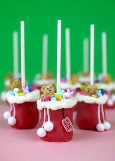 small cupcakes decorated with teddy bears and candles