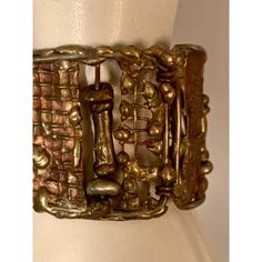 This is part of Chairish's Costume Jewelry Collection.  A striking cuff bracelet composed of hand made panels of brass and bronze by Pal Kepenyes in several different brutalist designs is from the same estate as the Milagros necklace.  This piece is unsigned and at some point the previous owner replaced the clasp.  It is in good, unsigned condition. Measurements; Length 7"    Width 1.75" Handmade Modernist Brass Jewelry, Handmade Brass Modernist Jewelry, Contemporary Metal Cuff Bracelet, Handmade Antique Metal Cuff Bracelet, Adjustable Brutalist Metal Bracelets, Adjustable Brutalist Metal Bracelet, Gold Adjustable Modernist Bracelet, Adjustable Gold Modernist Bracelet, Unique Gold Cuff Bracelet For Collectors