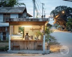 a small food stand on the side of a road